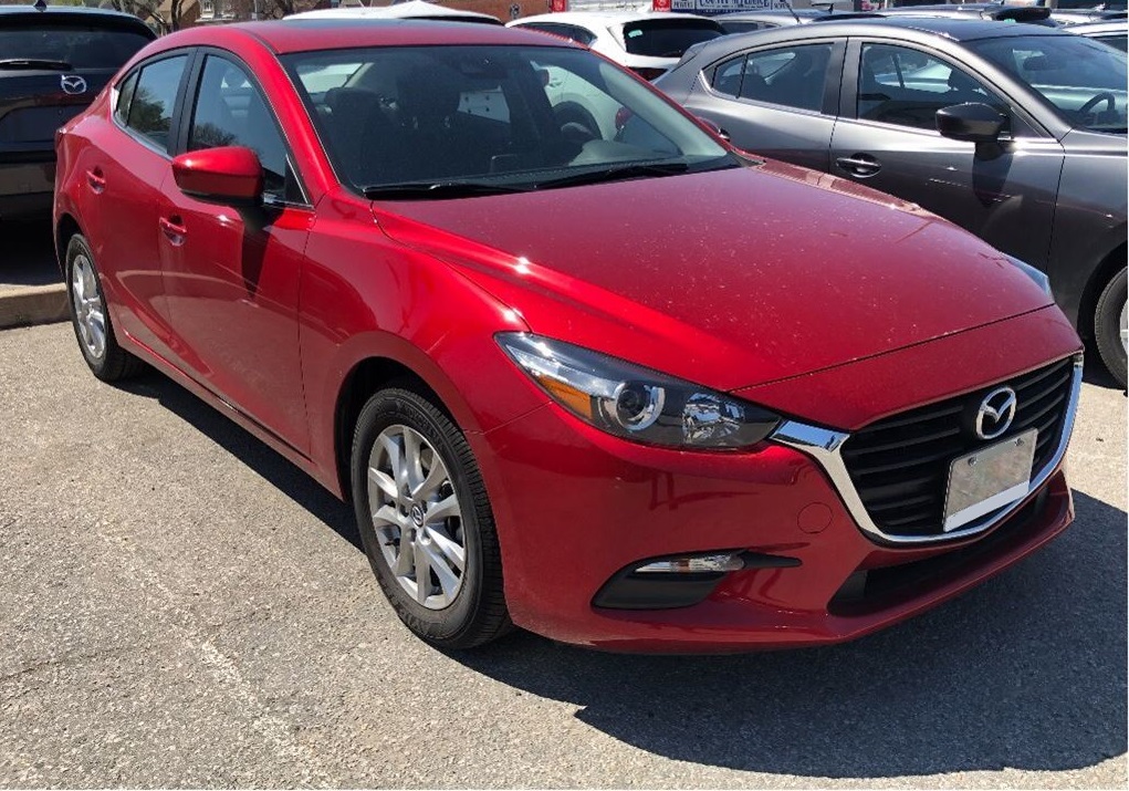 2018 Red Mazda3 Parked in a lot small affordable cheap car