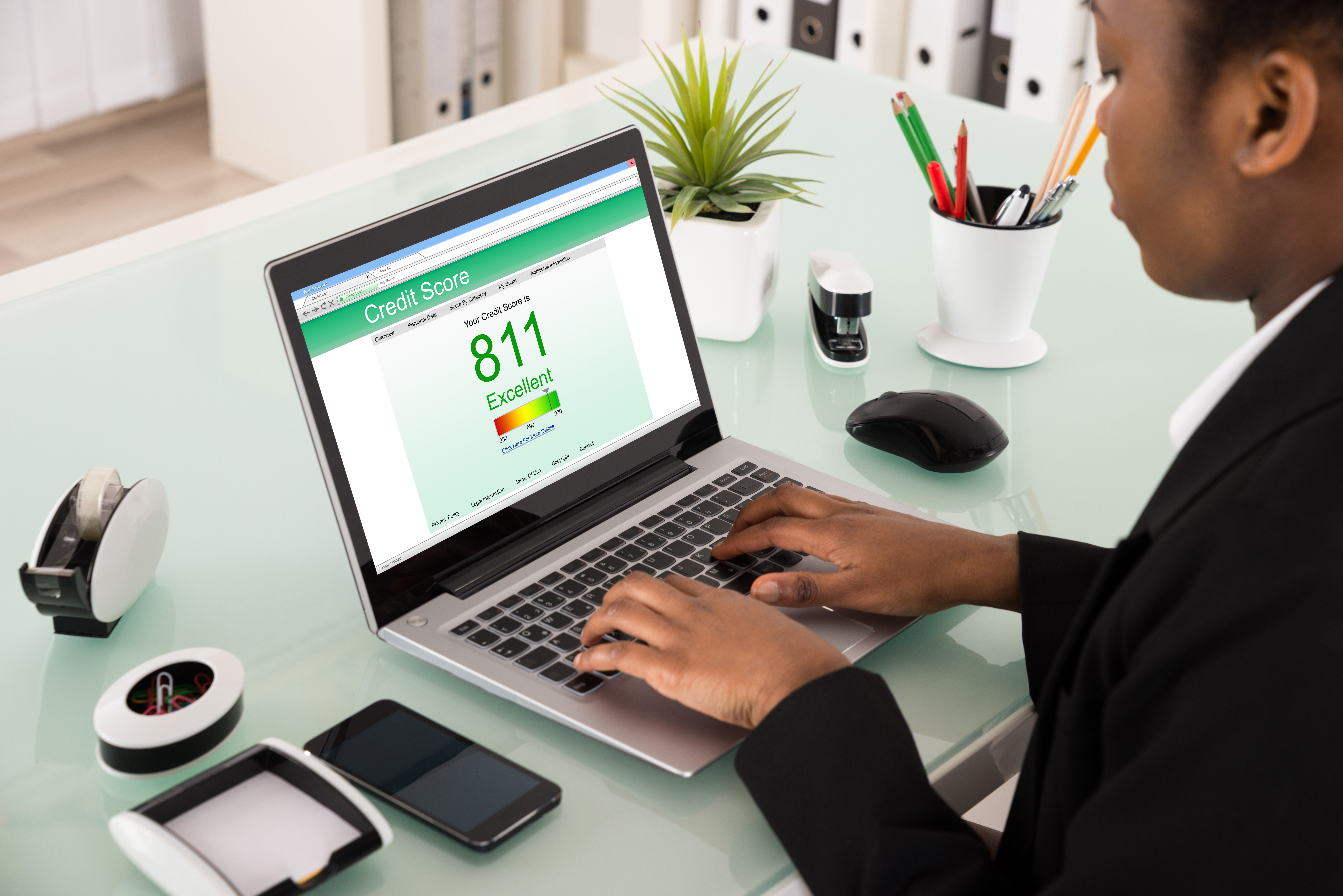 Young African Businesswoman Checking Credit Score On Laptop At Office